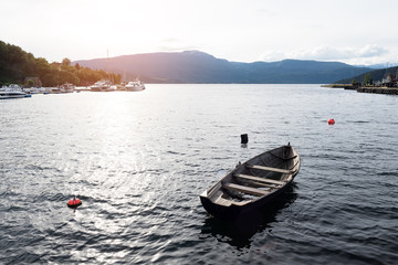 Old wooden boat in the fjord of Norway