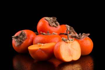 Persimmon in a cut on a black background
