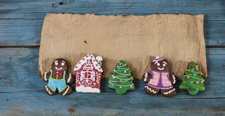 Christmas background with ginger cookies on wooden background