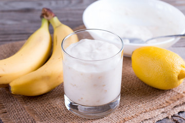 Yogurt with banana in a glass cup
