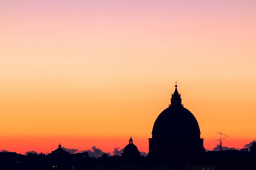 Panorama view of Rome at sunset with St Peter Cathedral