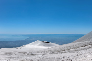 landscape of snow on mount etna volcano crater
