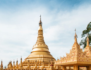 Fototapeta premium Simulate of Shwedagon Pagoda at Suwankiri Temple, Ranong, Thailand