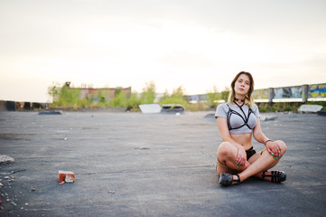 Fototapeta premium Girl wear on shorts and black erotic fetish underwear at roof.