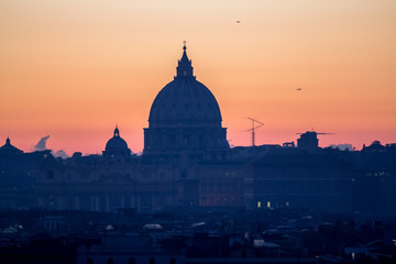 Fototapeta na wymiar Panorama view of Rome at sunset with St Peter Cathedral