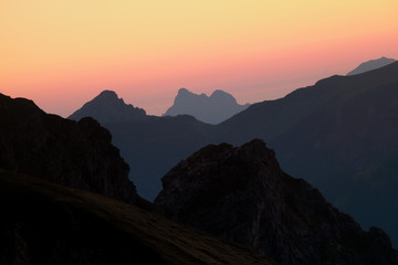 Fototapeta na wymiar mountain silhouettes over sky at sunrise