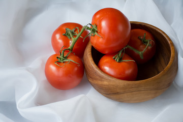 Processing fresh red ripe tomatoes for some salsa and salad