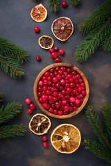 Fresh ripe cranberry in wooden bowl