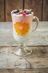 cocktail with berries and chia seeds are layered