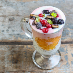 cocktail with berries and chia seeds are layered