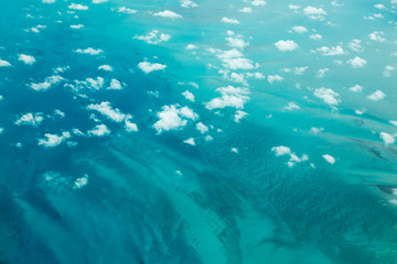 Fototapeta na wymiar Clouds and Turquoise Sea