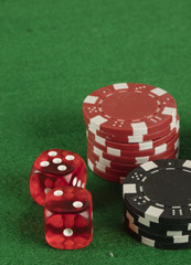 two red dices and different color chips