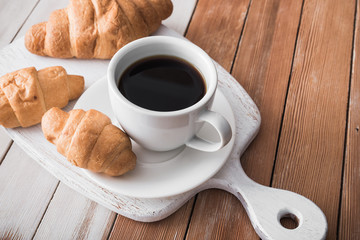 aroma cup of coffee with sweet croissant