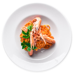 Pasta and tiger shrimp in tomato sauce. Italian traditional food. isolated.