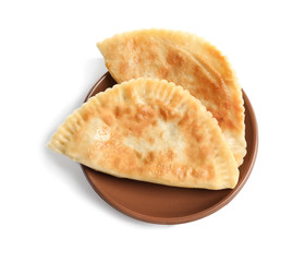 Plate with deep fried samosas on white background