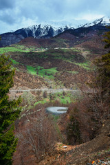 Panoramic view on snow winter spring mountains and cloud sky. Caucasus Mountains. Svaneti region of Georgia.