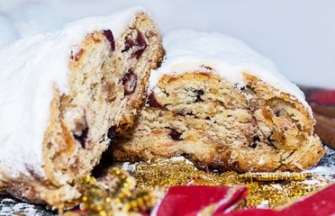 Christmas shtollen on a green background. Traditional German dessert
