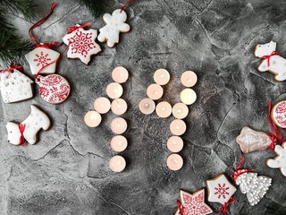 Date in calendar. December day. Christmas is coming. Advent. New Year and Christmas background. Number from candle light. Homemade Christmas cookies. 31 of December