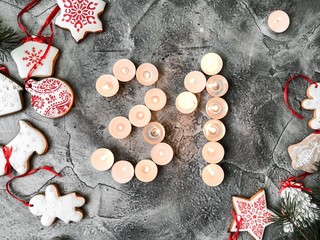 Date in calendar. December day. Christmas is coming. Advent. New Year and Christmas background. Number from candle light. Homemade Christmas cookies. 31 of December