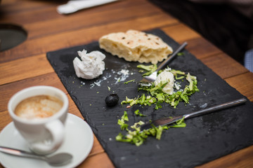 Empty wooden plate after eating in restaurant.