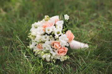 wedding flower bouquet on green grass
