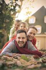 Fototapeta premium Happy family at backyard poses to camera.