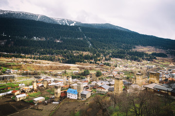 Fototapeta na wymiar Panoramic view on Svan tower in Upper Svaneti village Mestia, Georgia