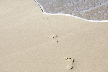 Human footprints on the beach sand
