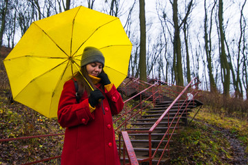 young pretty woman with yellow umbrella