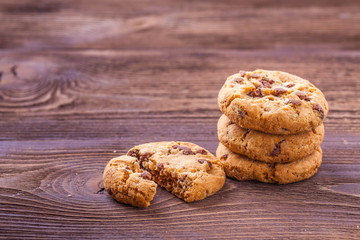 cookies with chocolate on a wooden background