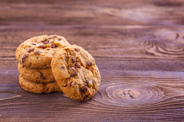 cookies with chocolate on a wooden background