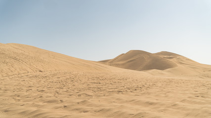 Fototapeta na wymiar Huacachina desert and dunes of sand in Ica region, Peru.