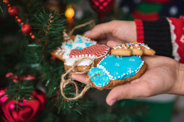 A little boy and his mother decorate the tree.