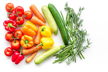 Colorful vegetables for healthy diet. Paprika, tomatoes, carrot, zucchini, eggplant on white background top view