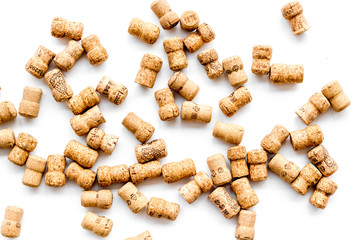 Corks of wine bottles on white background top view