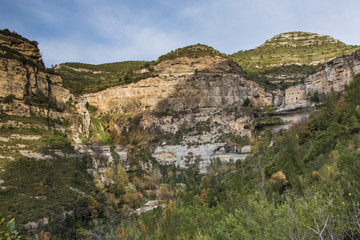 Fototapeta premium Waterfall and monastery of Sant Miquel del Fai
