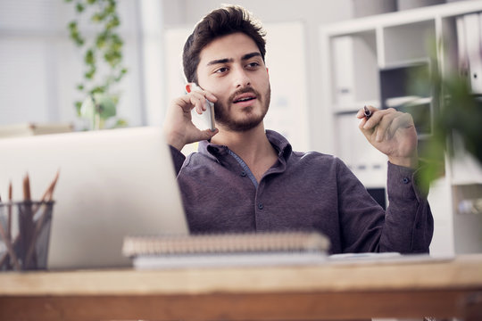 Young man talking mobile phone