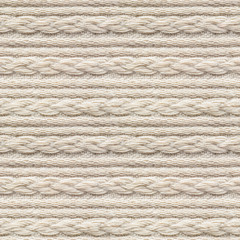 Seamless Beige Knitwear Fabric Texture with Pigtails. Repeating Machine Knitting Texture of Sweater. Beige Knitted Background.