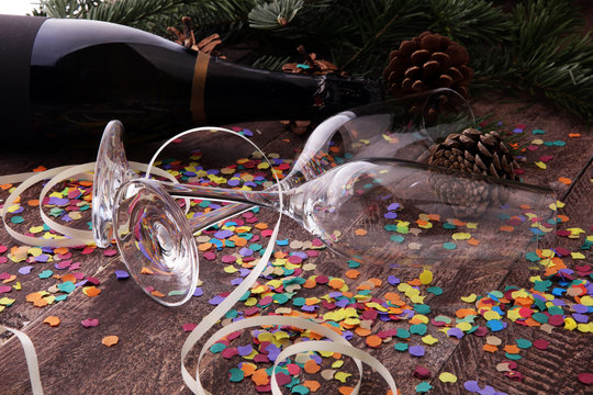 Party with champagne, glasses and confetti. New Year's Eve or birthday