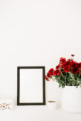 Photo frame mock up, beautiful red flowers bouquet, white vintage casket in front of white background. Blog, website composition.