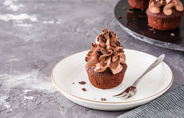 Chocolate cupcakes on a dark background.