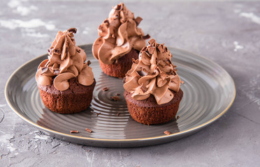 Chocolate cupcakes on a dark background.