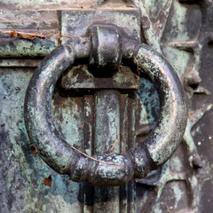Closeup of a old metal door knocker.