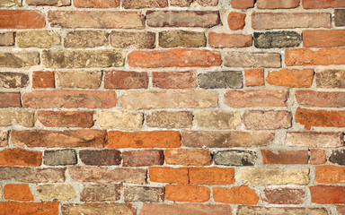 ancient wall made with many red bricks