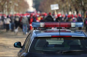 police car during the demonstration with the rioters