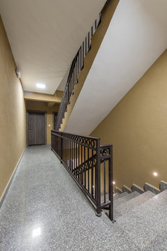 Staircase with metallic handrails in modern interior