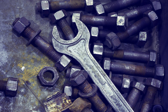 Wrench and nut.Industrial tools. Photo tinted.