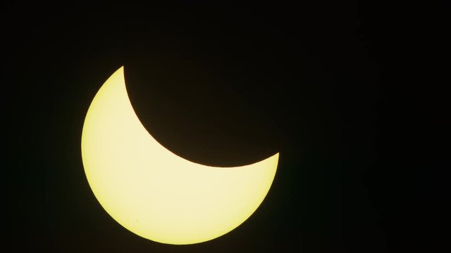 Silhouette of drone flying near partial solar eclipse / Driggs, Idaho, United States