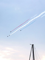 SAINT TROPEZ, PROVENCE, FRANCE - AUGUST 12TH 2014: Group of Jet Fighters Performing Acrobatic Tours During An Event Remembering 70 Years Since D-Day. Smoke Patterns Resemble the French Flag