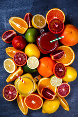 Juices Fresh Orange and Citrus.Healthy Beverage.Food or Healthy diet concept.Mixed Colorful Tropical Background.Copy space for Text. selective focus